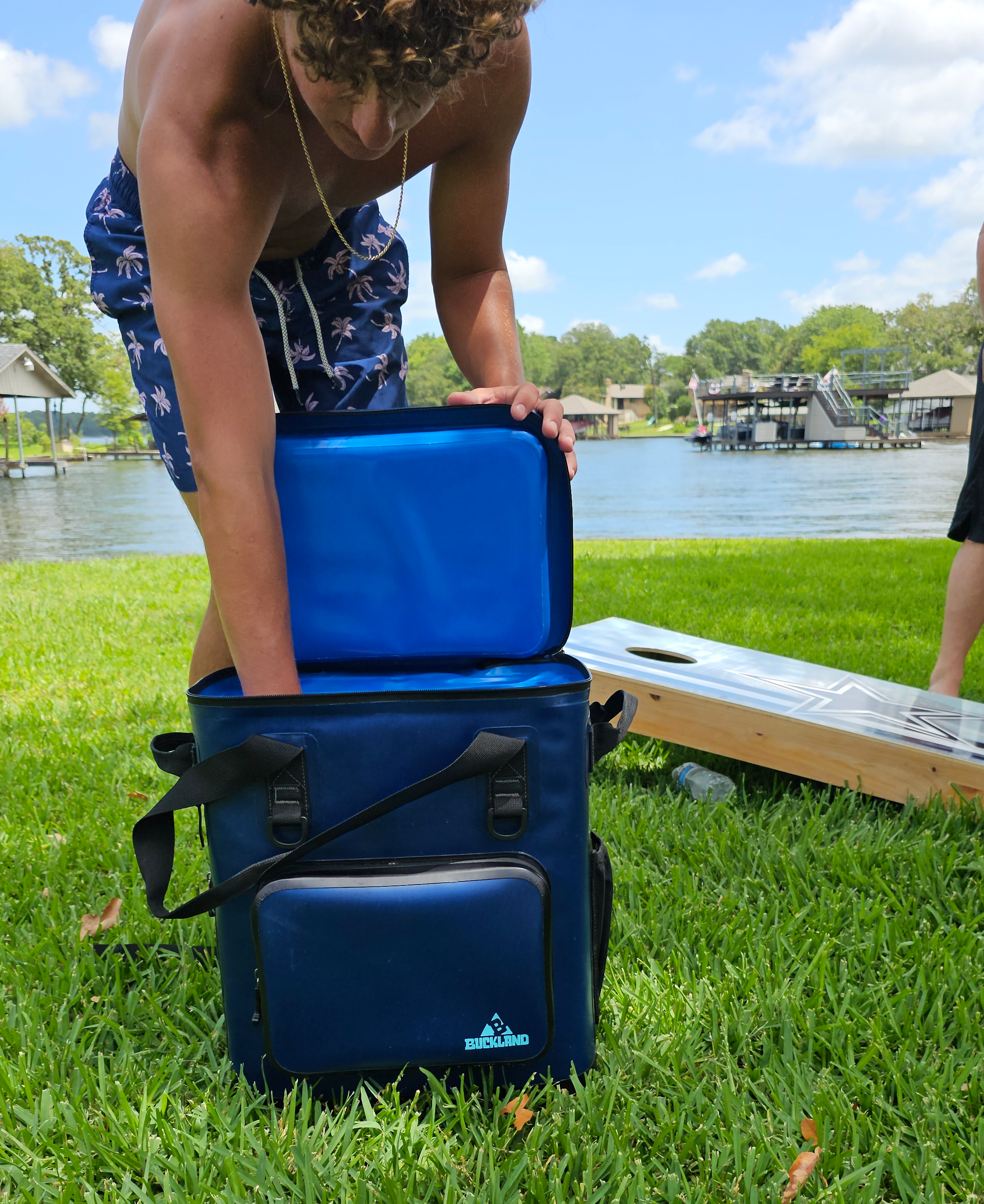 "25-liter insulated backpack cooler in black with multiple pockets for camping and hiking adventures"