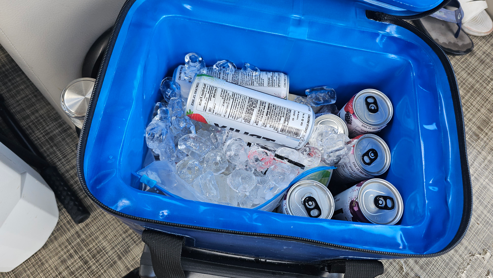 "25-liter insulated backpack cooler in black with multiple pockets for camping and hiking adventures"